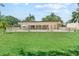 Beautiful community pool surrounded by lush landscaping, ideal for relaxation at 11511 113Th St # 35E, Largo, FL 33778