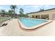 Large community pool with a spacious deck and plenty of seating areas for socializing at 11511 113Th St # 35E, Largo, FL 33778