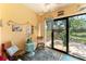 Bright sunroom features outdoor views, coastal decor, and comfortable seating for relaxing at 11511 113Th St # 35E, Largo, FL 33778