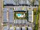 Aerial view of townhome community featuring a pool and lush landscaping in a well-maintained neighborhood at 1182 25Th N Way, St Petersburg, FL 33713