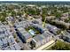 Aerial view of modern townhomes with a central pool and lush landscaping in a well-planned community at 1182 25Th N Way, St Petersburg, FL 33713
