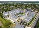 Aerial view of modern townhomes with community pool and landscaped green spaces in a vibrant neighborhood at 1182 25Th N Way, St Petersburg, FL 33713