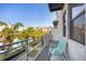 Balcony view of community with a pool, palm trees, and modern architecture at 1182 25Th N Way, St Petersburg, FL 33713
