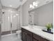 Modern bathroom featuring a glass enclosed shower, neutral paint, and vanity at 1182 25Th N Way, St Petersburg, FL 33713