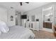 Bedroom with neutral tones featuring a dresser, mirror, and a bathroom at 1182 25Th N Way, St Petersburg, FL 33713