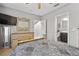 Comfortable bedroom with a wooden bed frame, neutral walls, and a view of the stairs and adjoining bathroom at 1182 25Th N Way, St Petersburg, FL 33713