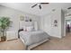 Bedroom features neutral colors, a padded headboard, and bright, natural light at 1182 25Th N Way, St Petersburg, FL 33713