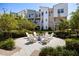 Charming common area with an outdoor fire pit surrounded by comfortable seating and lush landscaping at 1182 25Th N Way, St Petersburg, FL 33713