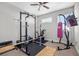 Well-equipped exercise room with weightlifting gear, bike, punching bag, and TV for workouts at 1182 25Th N Way, St Petersburg, FL 33713