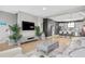 Spacious living room flows into the kitchen, complete with sleek furniture, hardwood floors, and modern decor, for easy living at 1182 25Th N Way, St Petersburg, FL 33713