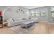 Bright living room with contemporary decor, white furniture, large windows, and hardwood floors, creating a relaxing atmosphere at 1182 25Th N Way, St Petersburg, FL 33713