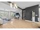 Open-concept living space featuring modern furnishings, hardwood floors, and neutral color scheme, perfect for relaxation and gatherings at 1182 25Th N Way, St Petersburg, FL 33713