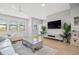 Cozy living room with modern decor, hardwood floors, and an abundance of natural light creating a serene and inviting atmosphere at 1182 25Th N Way, St Petersburg, FL 33713