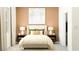 Inviting bedroom featuring a plush bed, stylish nightstands, and ample natural light at 11829 Sparkling Topaz Cv, Parrish, FL 34219