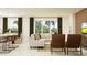 Open-concept living area featuring modern decor, comfortable seating, and plenty of natural light at 11829 Sparkling Topaz Cv, Parrish, FL 34219