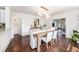 Open dining room with hardwood floors and a view into the living area at 1207 E Giddens Ave, Tampa, FL 33603