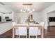 Dining room with modern lighting and an open layout to the kitchen at 1207 E Giddens Ave, Tampa, FL 33603