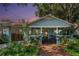 Charming home with craftsman details, a welcoming front porch, and lush landscaping at 1207 E Giddens Ave, Tampa, FL 33603