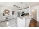 Bright kitchen featuring white cabinets, stainless steel appliances, and granite countertops at 1207 E Giddens Ave, Tampa, FL 33603