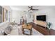 Open living room showcasing hardwood floors and a view of the dining area at 1207 E Giddens Ave, Tampa, FL 33603