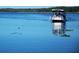 An image of a boat on the serene lake at 1218 Gillespie N Dr, Palm Harbor, FL 34684