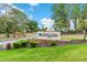 Highland Lakes Club community sign on a beautiful day at 1218 Gillespie N Dr, Palm Harbor, FL 34684