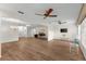 Spacious open-concept living room featuring wood floors, natural light, and versatile design options at 1218 Gillespie N Dr, Palm Harbor, FL 34684