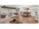 Spacious living area features wood floors, a dining area, and a seamless flow to the kitchen at 1218 Gillespie N Dr, Palm Harbor, FL 34684