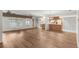 Bright and airy living room features wood floors and ample natural light for a comfortable living space at 1218 Gillespie N Dr, Palm Harbor, FL 34684