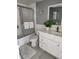 Clean bathroom with a white vanity, tiled floors, and a glass-enclosed shower at 1221 Drew St # B17, Clearwater, FL 33755