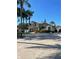Inviting two-story home featuring lush landscaping and mature palm trees in a desirable neighborhood at 13211 Park Blvd, Seminole, FL 33776