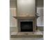 Cozy fireplace with decorative mantel, stone surround, and hearth details at 13211 Park Blvd, Seminole, FL 33776