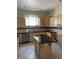 Functional kitchen with tile backsplash, stainless steel appliances, and a center island at 13211 Park Blvd, Seminole, FL 33776