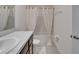Cozy bathroom featuring a granite countertop vanity, a shower/tub, and linen closet enhances home functionality at 138 Mangrove Shade Cir, Apollo Beach, FL 33572