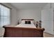 Bedroom features a window, with a comfortable-looking bed, and side table that enhance the living space at 138 Mangrove Shade Cir, Apollo Beach, FL 33572