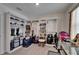 This is an organized walk-in closet featuring open shelving and hanging space, offering storage solutions at 138 Mangrove Shade Cir, Apollo Beach, FL 33572