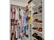 Organized walk-in closet features ample shelving and hanging space for clothes, shoes, and accessories at 138 Mangrove Shade Cir, Apollo Beach, FL 33572