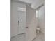 Inviting entryway with tile flooring, a view of a half bathroom, and a glimpse into the home at 138 Mangrove Shade Cir, Apollo Beach, FL 33572