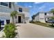 Well-maintained townhome with a one-car garage, concrete driveway, and green lawn at 138 Mangrove Shade Cir, Apollo Beach, FL 33572
