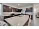 Well-equipped kitchen featuring stainless steel appliances, ample counter space, and dark cabinetry at 138 Mangrove Shade Cir, Apollo Beach, FL 33572