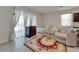 Cozy living room featuring ample seating, a decorative rug, and lots of sunlight at 138 Mangrove Shade Cir, Apollo Beach, FL 33572