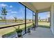 Spacious screened patio with scenic views of the lake at 138 Mangrove Shade Cir, Apollo Beach, FL 33572