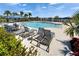 Enjoy the community pool featuring ample seating, lounge chairs and sunshades for hot sunny days at 138 Mangrove Shade Cir, Apollo Beach, FL 33572