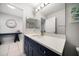 Stylish bathroom featuring modern vanity, updated fixtures, and convenient mirrors at 1412 Gulf Blvd # 103A, Indian Rocks Beach, FL 33785