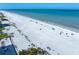 Aerial view of beautiful shoreline featuring white sand, clear water, and oceanfront living at 1412 Gulf Blvd # 103A, Indian Rocks Beach, FL 33785