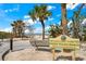 Entrance to the Indian Rocks Beach access park, featuring signage, benches, and sandy path at 1412 Gulf Blvd # 103A, Indian Rocks Beach, FL 33785