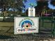Community Dog Park sign with cartoon dog; a fun space for neighborhood pets and owners at 1412 Gulf Blvd # 103A, Indian Rocks Beach, FL 33785