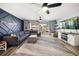 Spacious living room with comfortable seating and a modern entertainment center, perfect for relaxing at 1412 Gulf Blvd # 103A, Indian Rocks Beach, FL 33785