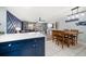Bright and airy living room with ocean-themed accents and access to a balcony at 1412 Gulf Blvd # 103A, Indian Rocks Beach, FL 33785