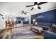 Open concept living space flows from kitchen to dining and living room, with ocean-themed decor at 1412 Gulf Blvd # 103A, Indian Rocks Beach, FL 33785